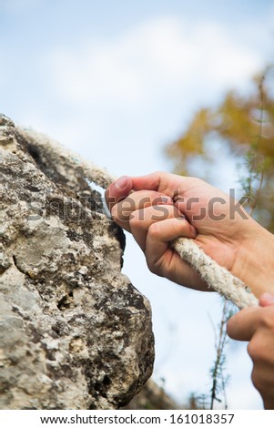 Hands the Rock Climber With Rope.