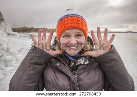 Portrait of the smiling elderly woman winter outdoors