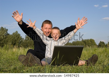 Happy family and the computer