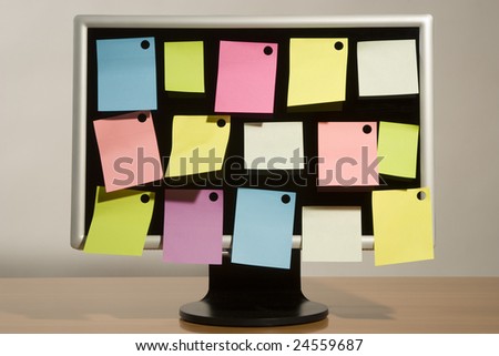 multicoloured sticky notes and liquid-crystal wide screen