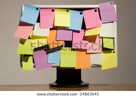 multicoloured sticky notes and liquid-crystal wide screen