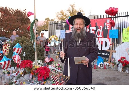 SAN BERNARDINO, CA - DECEMBER 6: Jewish rabbi lights first Hanukkah candle at a makeshift memorial to IRC shooting victims on December 6, 2015 in San Bernardino, California.