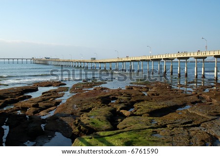 Pier and tide pool at low tide; Ocean Beach; San Diego, California.