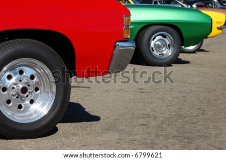 Colorful row of classic muscle cars on display at a car show; San Bernardino, California