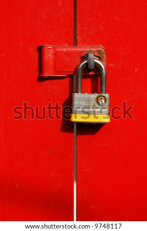 Pad lock on red door; Balboa Park; San Diego, California