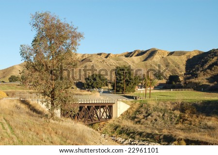 Rural road and bridge over creek; Live Oak Canyon, California