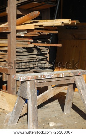 Wood building material and wooden sawhorse; Hyde Street Pier; San Francisco, California