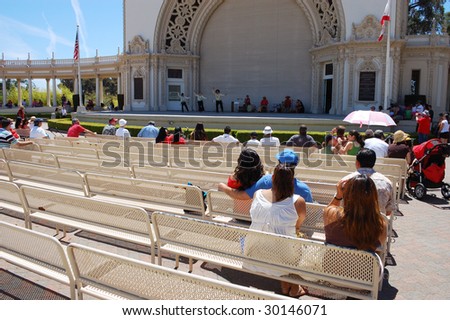 SAN DIEGO, CA - APRIL 19: Visitors watch cultural dance group presentations at Earth Fair on April 19, 2009 in San Diego. The fair is a large annual event held at Balboa Park in San Diego.
