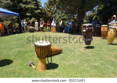 SAN DIEGO, CA - APRIL 19: Musicians play various percussion instruments in a drum circle at Earth Fair on April 19, 2009 in San Diego. The fair is a large annual event held at Balboa Park.