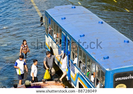 BANGKOK, THAILAND-NOVEMBER 12: Transportation of people in the streets flooded after the heaviest monsoon rain in 20 years in the capital on  November 12, 2011 Phahon Yothin Road, bangkok, Thailand.