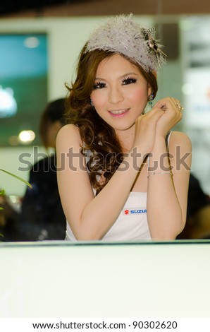 BANGKOK, THAILAND - DECEMBER 6: Unidentified female presenter at Suzuki booth in THE 28th THAILAND INTERNATIONAL MOTOR EXPO 2011 on December 6, 2011 in Bangkok, Thailand.
