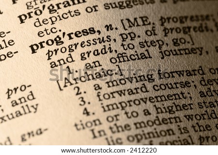 The word progress. Close-up of the word progress and its definition in a dictionary