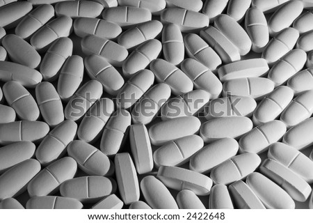 Pills. Background image of many white pills.