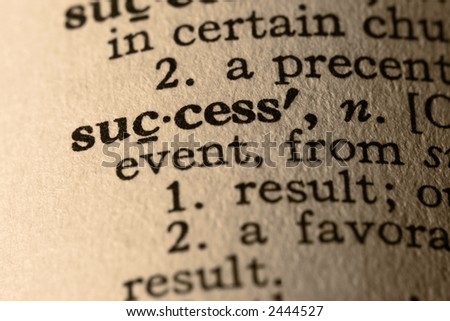 The word success. Close-up of the word success in a dictionary.