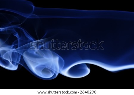 Blue Smoke 9. Abstract curves of blue smoke on a black background.