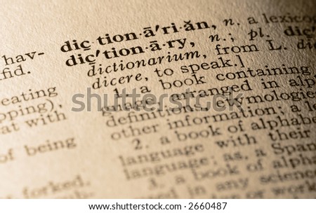 The word dictionary. Close-up of the word dictionary and its definition.