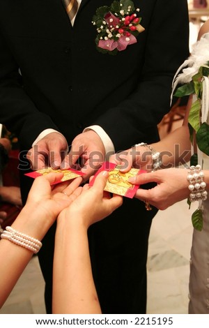 Chinese Wedding Tea Ceremony,mother giving red pocket to bride&bridgroom after served her a tea