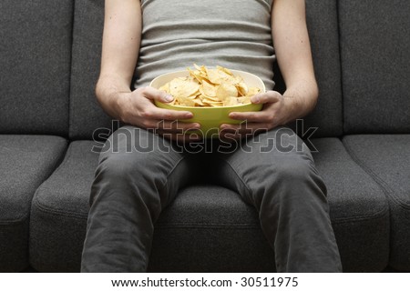 Man with bowl of chips