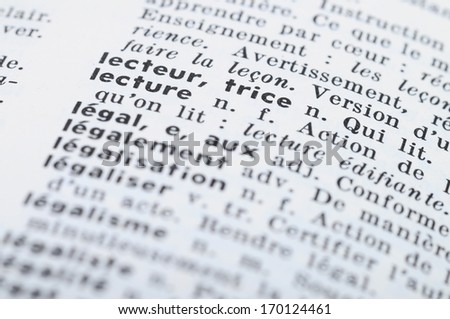 Close up of french dictionary at the word Reading