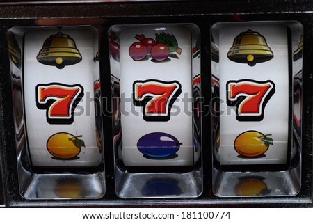 Close up of three seven jackpot on a casino slot machine