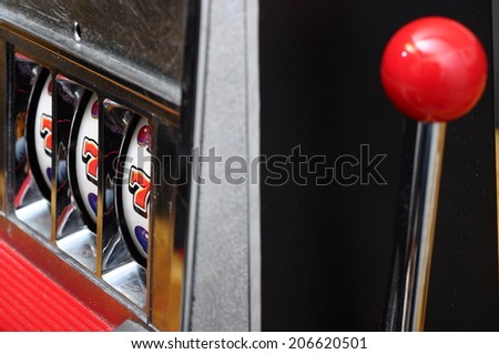 Close up of three seven jackpot on a casino slot machine