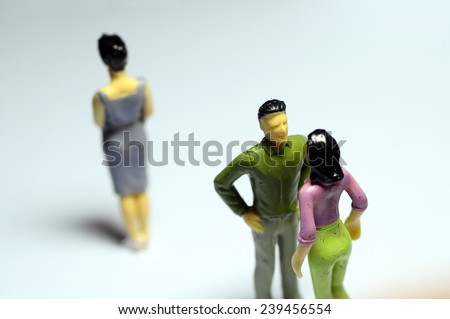 Miniature Man chatting with woman, and single woman turning back
