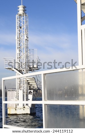 Detail of metallic white structure and blue sky