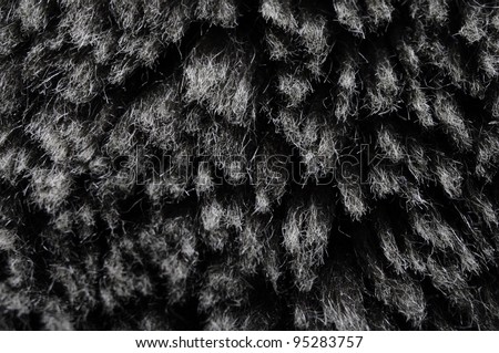 Close view of synthetic fibers of a false fur for texture or background