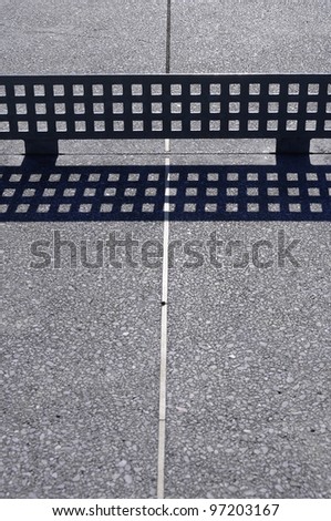 Outside Ping-pong table and grid created by shadows of the net