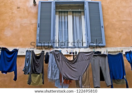 Laundry hanging out of a typical Italian facade, Rome, Lazio, Italy