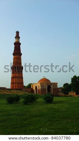 NEW DELHI - JULY 2: The Qutb Minar facade on July, 2, 2011 in New Delhi. The Qutb Minar is a tower located in Delhi, India and it is the world\'s tallest brick minaret with a height of 72.5 meters