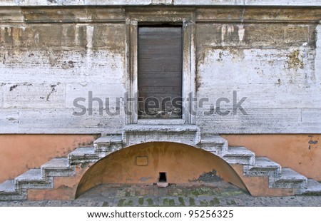 View of a door and two symmetric stairs
