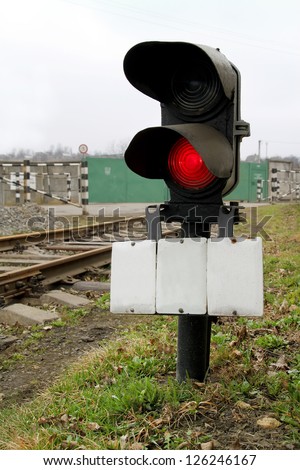 Traffic light shows red signal on railway. red light