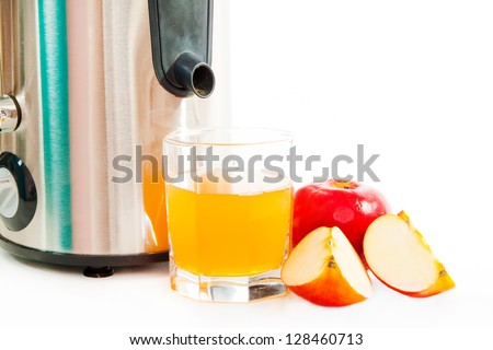 Juice extractor and freshly squeezed apple juice isolated on white