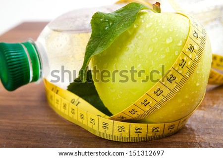 Apple core with water drops, bottled water for healthy life