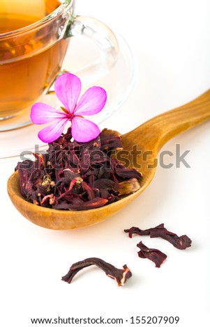 Fresh green, red, black tea leaves with pink flower on white background