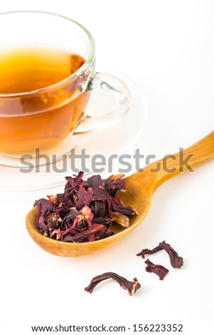 Fresh green, red, black tea leaves in big wooden spoon on white background