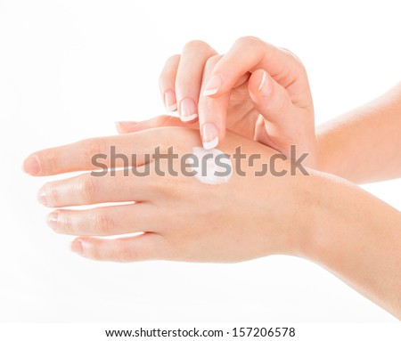 Beautiful young woman hands with cream isolated on white Beautiful young woman hands with cream isolated on white