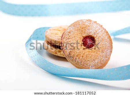 Cookies with jam with blue strip on white background