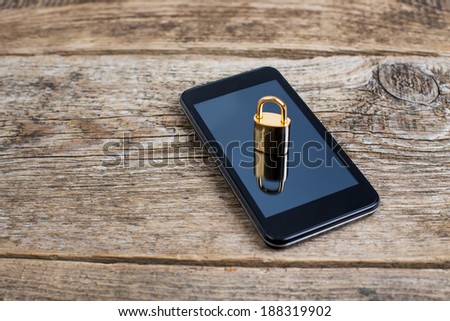 Modern smartphone with combination lock padlock. Concept of mobile phone security