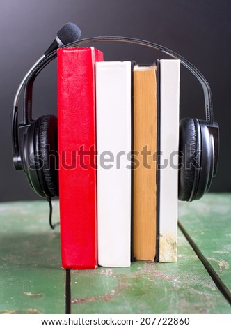 colorful audio book concept with headphones and books
