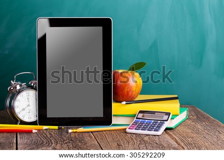 Tablet pc and different schoolchild and student studies accessories. Back to school concept.