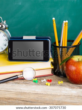 Tablet pc, smartphone and different schoolchild and student studies accessories. Back to school concept.