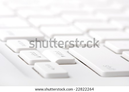 White laptop keyboard closeup. Hi-key composition. Selective focus on a \