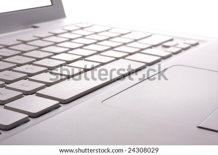 Part of white laptop closeup.