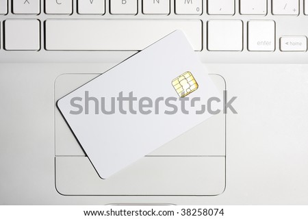 Modern security. White empty smart card close-up on laptop.