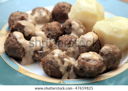Swedish meatballs on dish. A traditional scandinavian culinary delight served with potatoes. Shallow DOF.