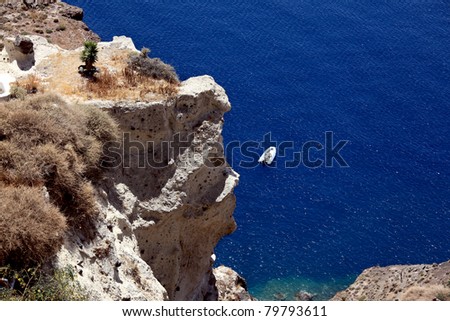 Cliff and sea. Above view. Oia, Santorini Island, Cyclades Islands, Aegean Sea, Greece.