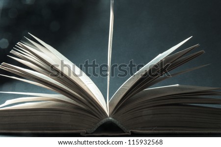 Concept of open book with blue bokeh