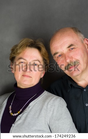 Closeup portrait of a happy older woman embracing smiling older man